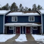 a house in Wisconsin with snow on the roof