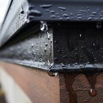 close up of a drip edge with water dripping off