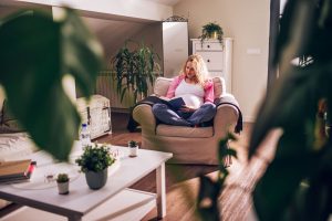 pregnant-woman-sitting-on-a-cozy-chair-and-reading