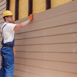 worker-building-house-siding