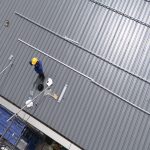 worker-maintaining-a-metal-roof