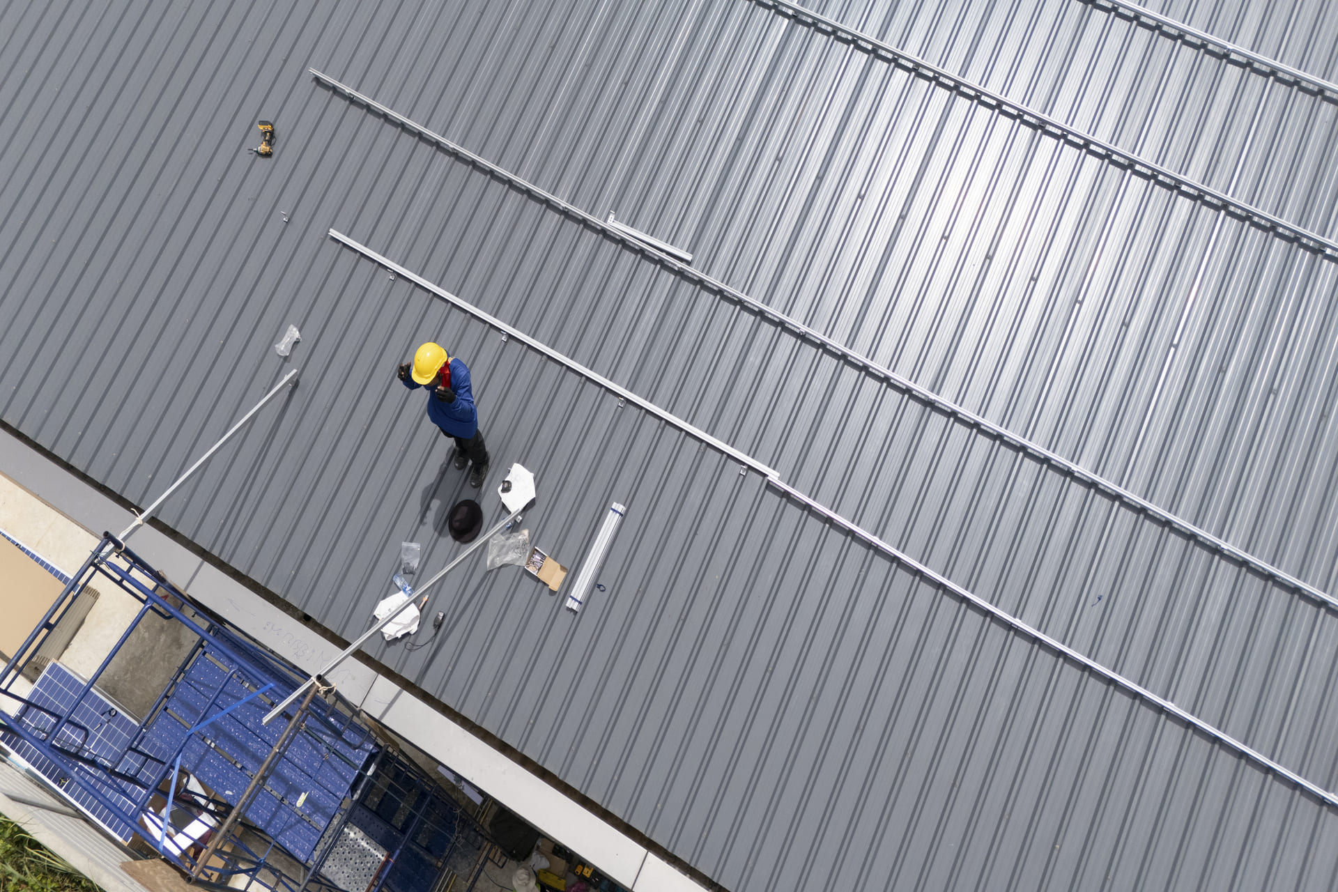 worker-maintaining-a-metal-roof