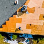 aerial-view-of-roof-partly-covered-with-plywood-and-shingles