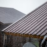brown-metal-roof-in-heavy-rainfall