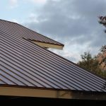 brown-standing-seam-metal-roof-with-chimney