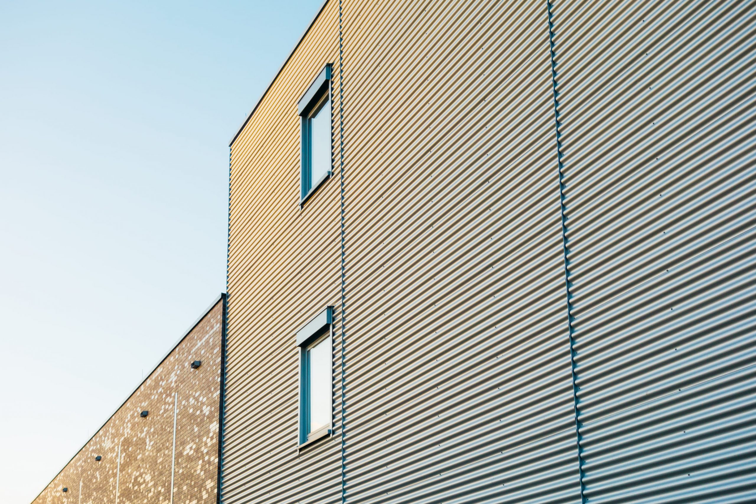 modern-building-with-light-metal-cladding-and-rectangular-windows